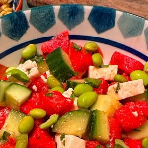 Closeup of Watermelon feta and broad bean salad in a bowl